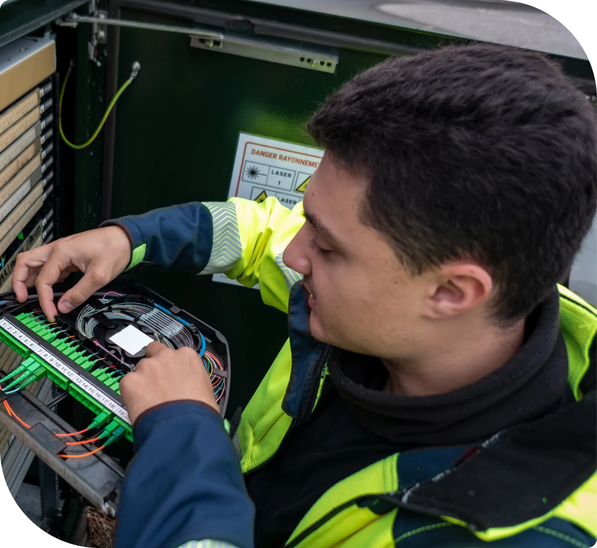 Technician working on fiber optic cables.