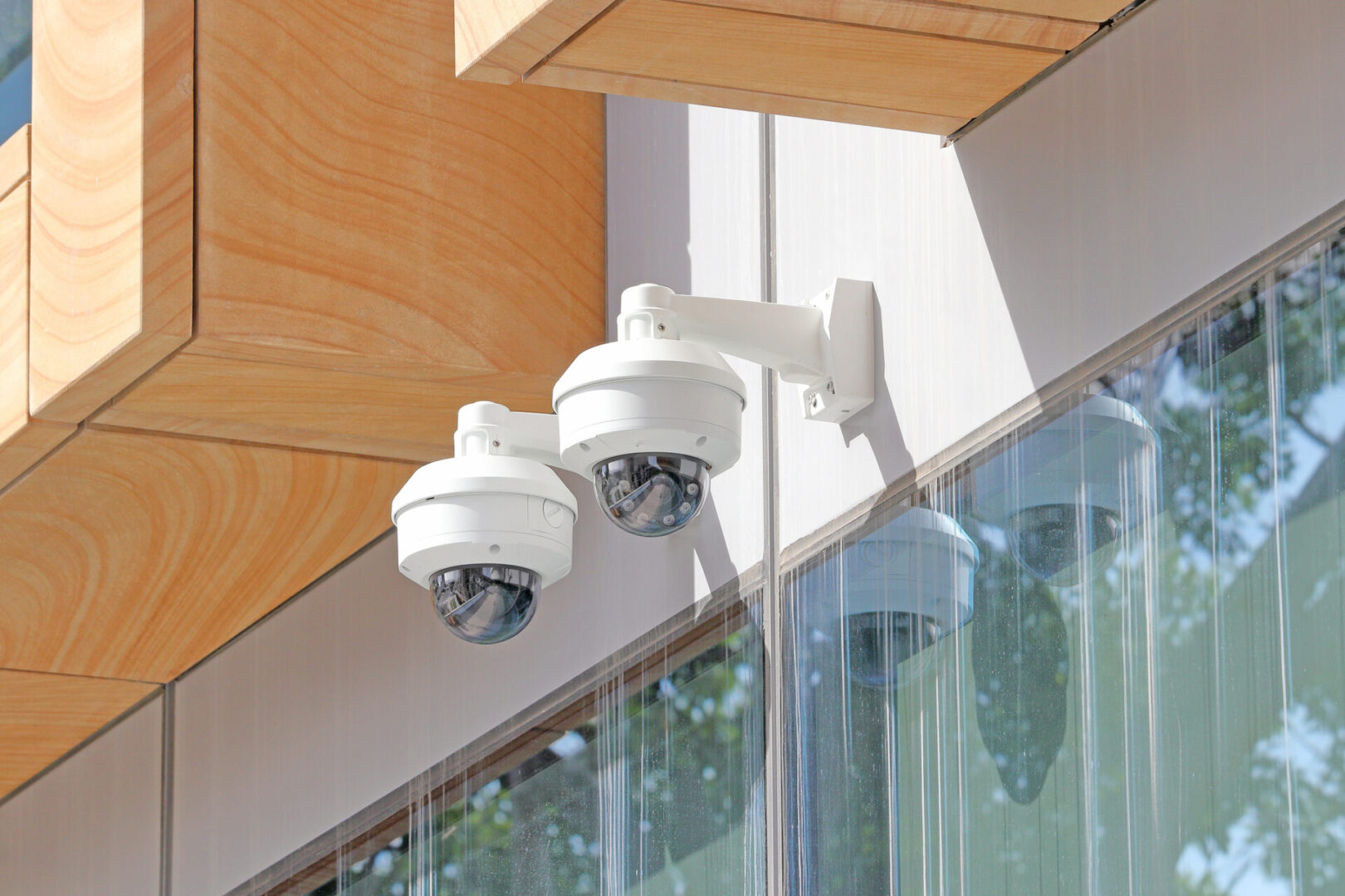 Two security camera's mounted on a wall